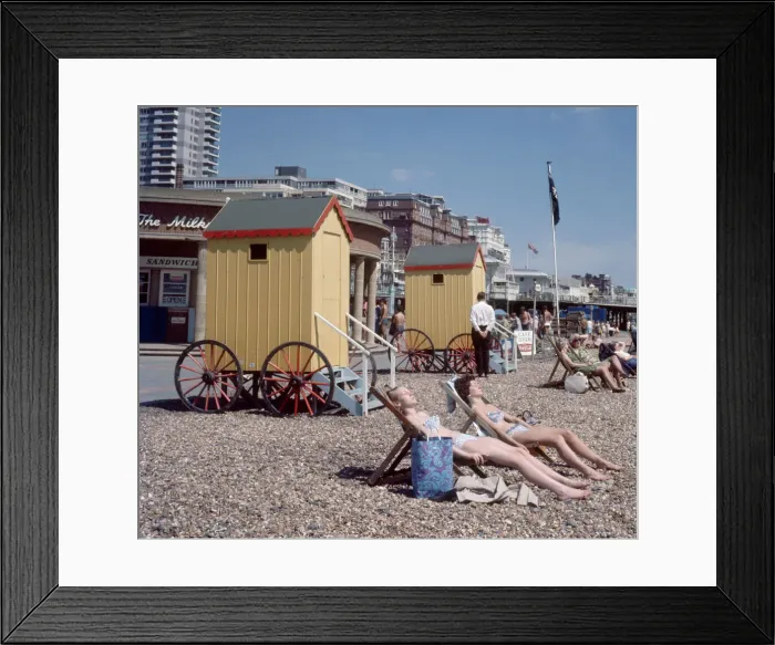 Framed Print : Old style bathing huts on the sea front at Brighton. 1st June 1968 Local Caption