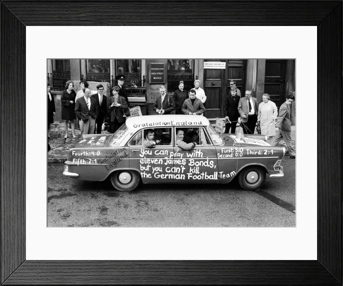 Framed Print : 1966 World Cup Tournament in England. A West German car with the message