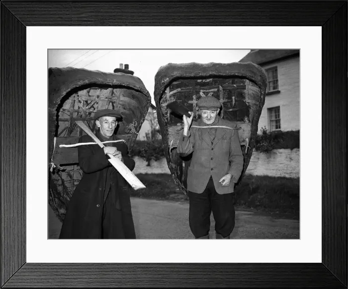 Framed Print : Coracle Fisherman with their craft on their backs- 1952 Framed Print : Coracle Fisherman with their craft on their backs- 1952