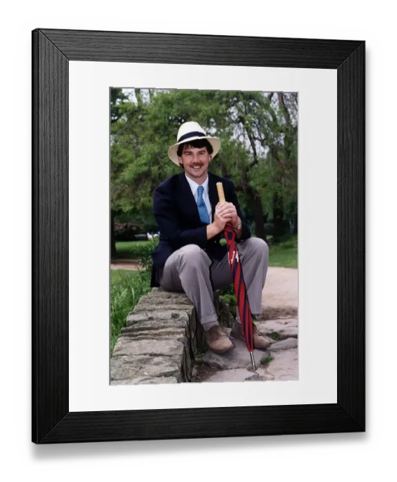 Framed Print : John Kettley TV Weather Forecaster Presenter on BBC TV sitting on small bridge wall Framed Print : John Kettley TV Weather Forecaster Presenter on BBC TV sitting on small bridge wall