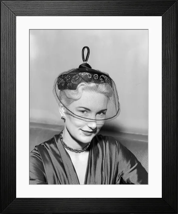 Framed Print : Hat Fashion by Norman Hartnell Unusual hat with netting covering the eyes Framed Print : Hat Fashion by Norman Hartnell Unusual hat with netting covering the eyes