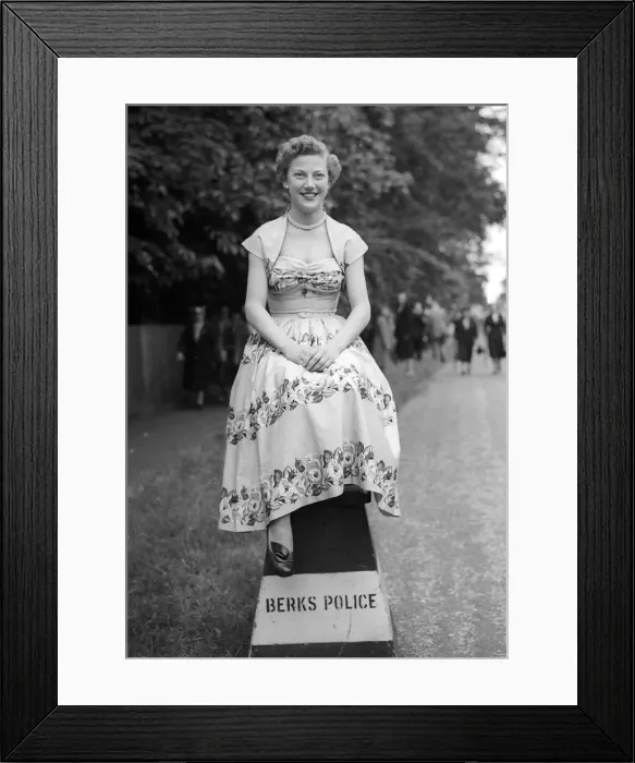 Framed Print : 1953 Clothing Ascot Fashion Miss Zaila Beckemayel sitting on a police sign laughing