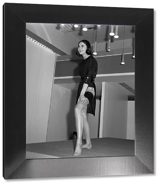 Mary Quant fashion clothing Model wearing slit dress showing her stockings