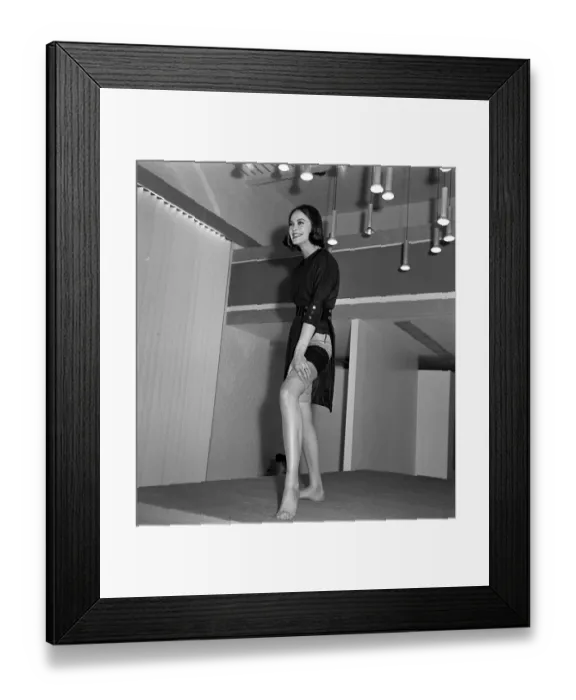 Framed Print : Mary Quant fashion clothing Model wearing slit dress showing her stockings Framed Print : Mary Quant fashion clothing Model wearing slit dress showing her stockings