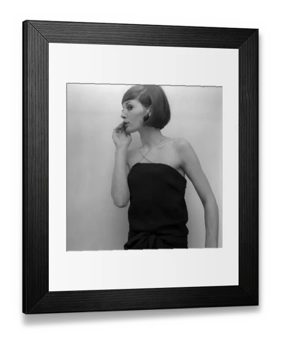 Framed Print : Mary Quant fashion clothing Model looking worried wearing a black dress with cross