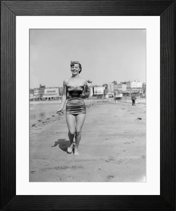 Framed Print : Clothing Beach wear swimsuits fashion April 1952 Model running along beach Framed Print : Clothing Beach wear swimsuits fashion April 1952 Model running along beach