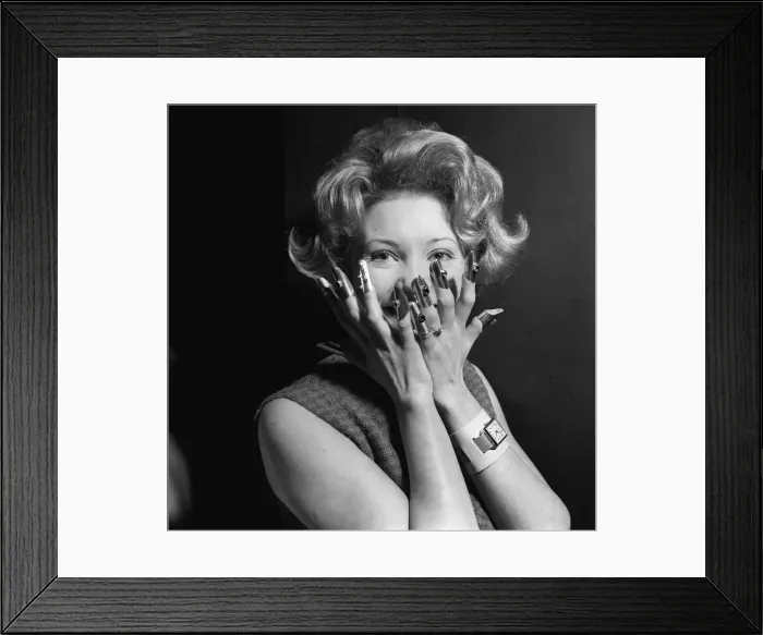 Framed Print : Fashion rings Model looking shocked, holding her hands to her mouth smiling wearing Framed Print : Fashion rings Model looking shocked, holding her hands to her mouth smiling wearing