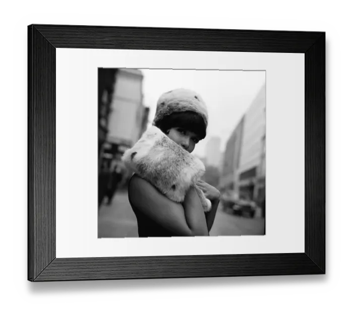 Framed Print : A model wears a fur hat and muff Fashion June 1965 hiding the lower part of her
