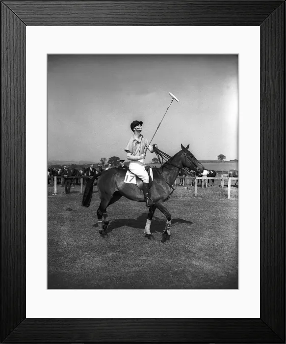 Framed Print : Prince Philip rides along on horseback holding a polo stick during a polo tournament Framed Print : Prince Philip rides along on horseback holding a polo stick during a polo tournament