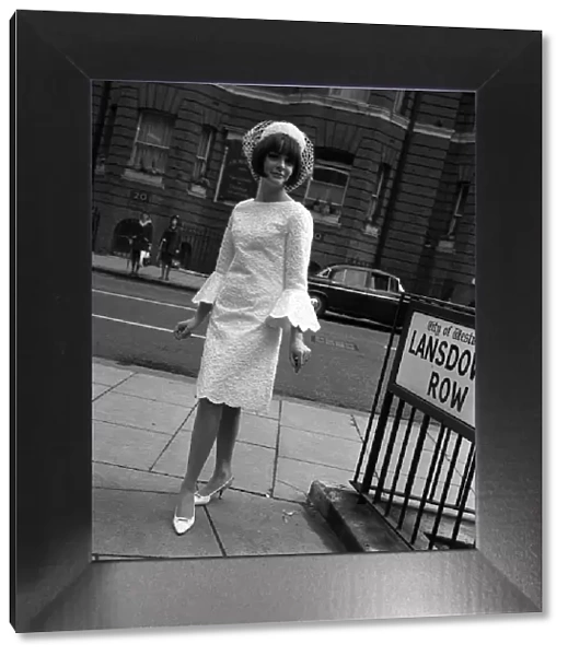 Sixties Fashion by Kiki Byrne Model wearinf white dress with wide sleeves