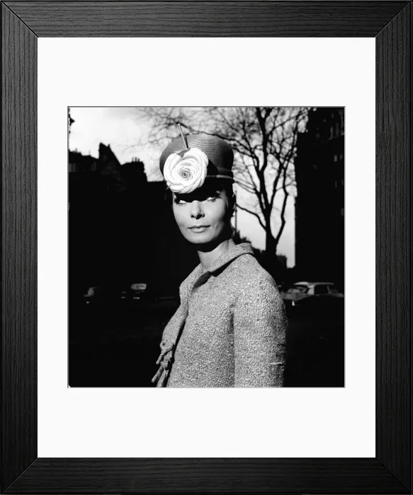 Framed Print : Fashion model Mignon Madden models a hat with flower decoration designed by Graham Smith Framed Print : Fashion model Mignon Madden models a hat with flower decoration designed by Graham Smith