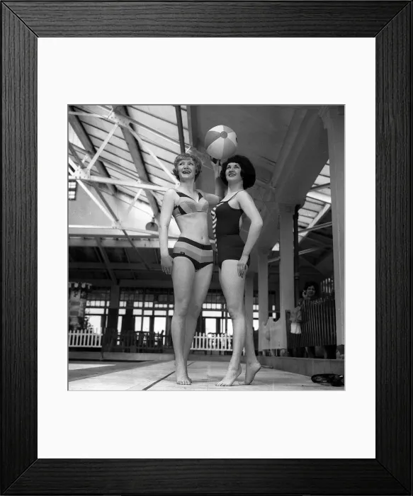 Framed Print : Swim Suit Fashions by Winserlee in Bri-nylon at Blackpool Two women pose with a Framed Print : Swim Suit Fashions by Winserlee in Bri-nylon at Blackpool Two women pose with a