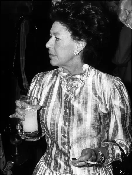 Princess Margaret smoking with cigarette holder and drinking orange at the Pye TV awards