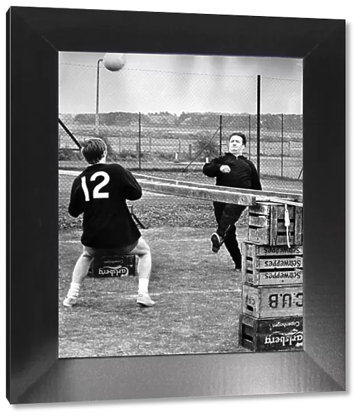 Jock Stein football manager Celtic FC training with Davie Hay kicking ball practice at