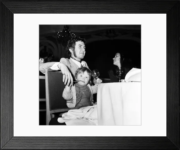 Framed Print : Ron Lane of The Faces pop group with his wife and daughter at New Musical Express Awards Framed Print : Ron Lane of The Faces pop group with his wife and daughter at New Musical Express Awards