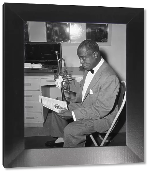 Louis Armstrong seen here in his dressing room before performing in London in May 1956