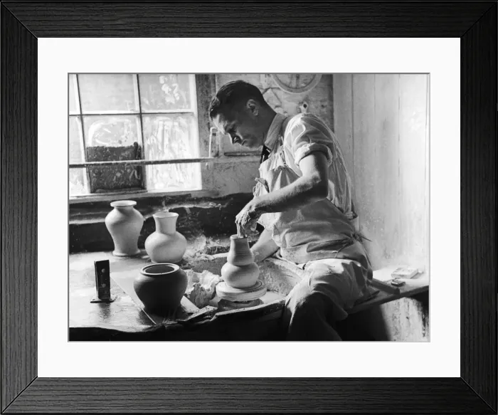 Framed Print : A potter at the Minton China Works in Stoke On Trent, creates a vase on his spinning Framed Print : A potter at the Minton China Works in Stoke On Trent, creates a vase on his spinning