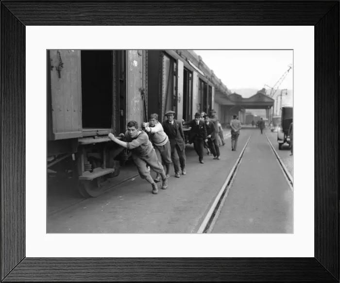 Framed Print : Undergraduates at Dover shunting luggage vans on to the boat train on the 8th day of