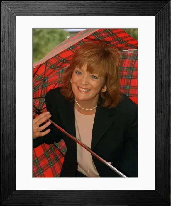 Framed Print : Sherrie Hewson cornation St actress holding a tartan umbrella Framed Print : Sherrie Hewson cornation St actress holding a tartan umbrella