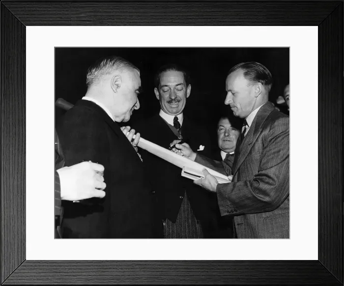 Framed Print : Don Bradman Australian cricketing legend autographs a Don Bradman cricket bat which will Framed Print : Don Bradman Australian cricketing legend autographs a Don Bradman cricket bat which will
