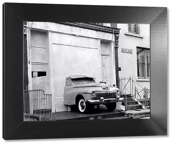 An American Dodge Car fitted into a Shop Window of a boutique called Granny Takes a Trip