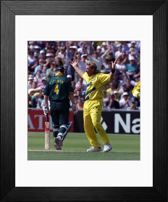 Framed Print : Shane Warne of Australia celebrates after taking the wicket Hansie Cronjie against South