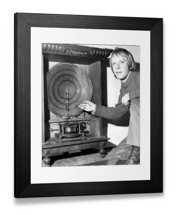 Framed Print : Anton Stanczyk looks at the victorian juke box, Polyphone, in the Museum in Saltwell Park