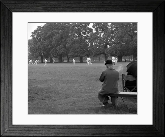 Framed Print : Man watching the cricket and smoking, Ham & Hampton Wick. 2359a Framed Print : Man watching the cricket and smoking, Ham & Hampton Wick. 2359a