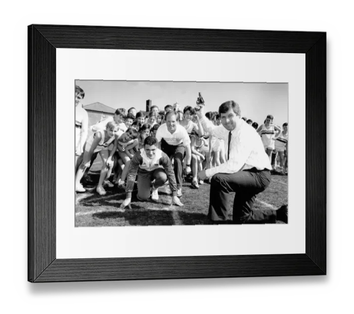 Framed Print : Brendan Foster, watched by Paul Ponton (centre) and Royal Grammer School sprinter Jason Framed Print : Brendan Foster, watched by Paul Ponton (centre) and Royal Grammer School sprinter Jason