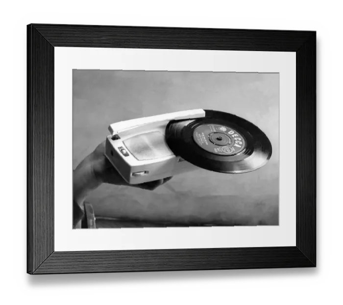 Framed Print : A tiny record player which is also a transistor radio in March 1963 27  /  03  /  63