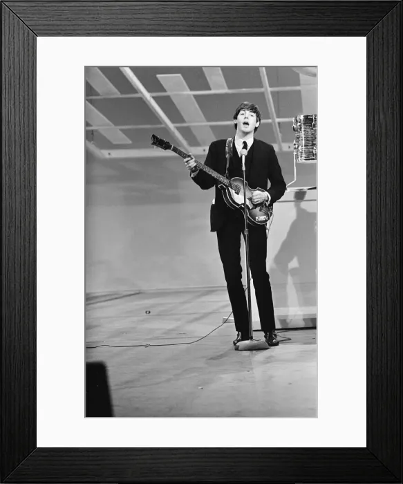 Framed Print : Paul McCartney, bass guitarist and singer with British pop group The Beatles rehearsing