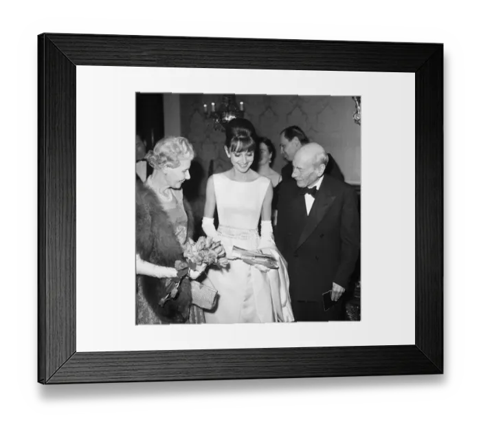 Framed Print : Actress Audrey Hepburn pictured with Earl and Countess Attlee at the London premiere of
