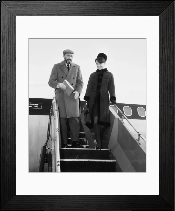 Framed Print : Actress Audrey Hepburn pictured with her husband Mel ferrer arriving in London Framed Print : Actress Audrey Hepburn pictured with her husband Mel ferrer arriving in London