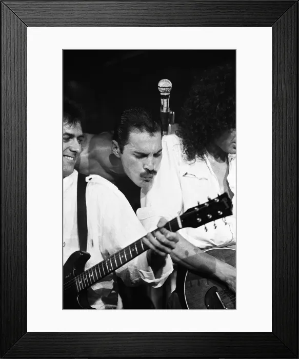 Framed Print : Rock group Queen in concert at Wembley Arena. Lead singer Freddie Mercury Framed Print : Rock group Queen in concert at Wembley Arena. Lead singer Freddie Mercury