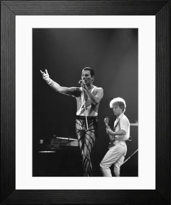 Framed Print : Freddie Mercury, lead singer of rock group Queen, delighted a packed audience Framed Print : Freddie Mercury, lead singer of rock group Queen, delighted a packed audience