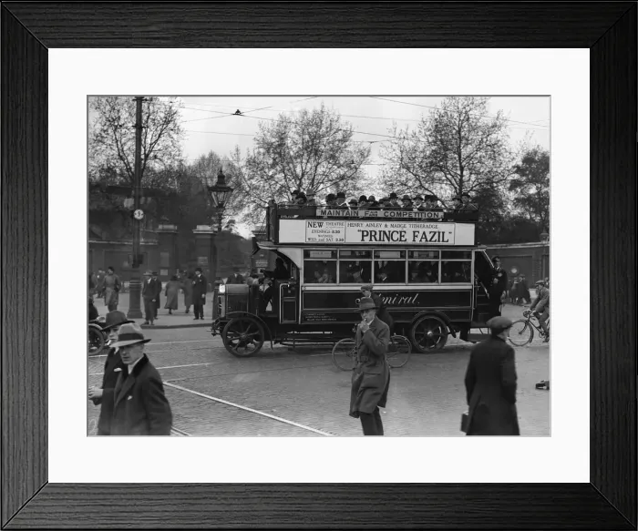 Framed Print : Commuters crowd onto buses whilst others make their way home from work on foot