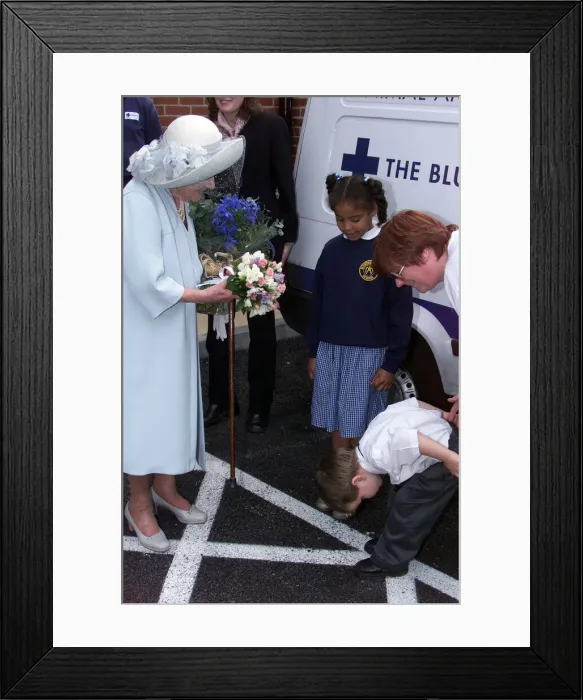 Framed Print : Four year old Nathan Goodwin bows to Queen Mother after presenting her with a bouquet of Framed Print : Four year old Nathan Goodwin bows to Queen Mother after presenting her with a bouquet of