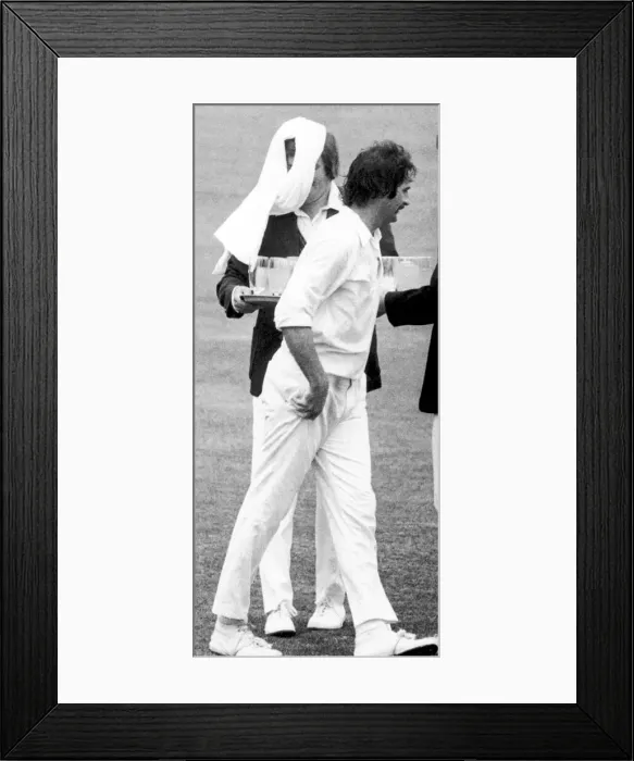Framed Print : The Ashes 1975. Australian fast bowler Dennis Lillee throws a towel over the head of Framed Print : The Ashes 1975. Australian fast bowler Dennis Lillee throws a towel over the head of