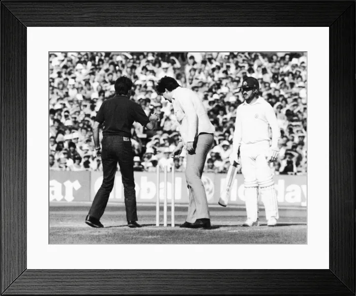 Framed Print : Ashes 1981. Pitch invasion at Old Trafford. Two fans remove the bails in front of a Framed Print : Ashes 1981. Pitch invasion at Old Trafford. Two fans remove the bails in front of a