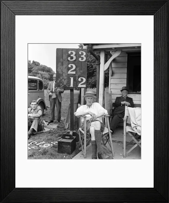 Framed Print : Scorer beside the scoreboard at the cricket pavilion, Meopham home to one of the oldest Framed Print : Scorer beside the scoreboard at the cricket pavilion, Meopham home to one of the oldest