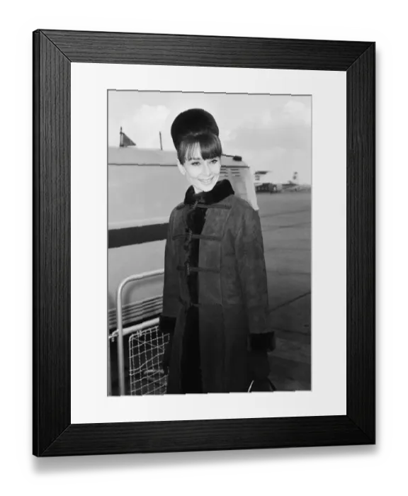 Framed Print : Actress Audrey Hepburn arriving in London from Zurich for the Royal Charity Premiere of