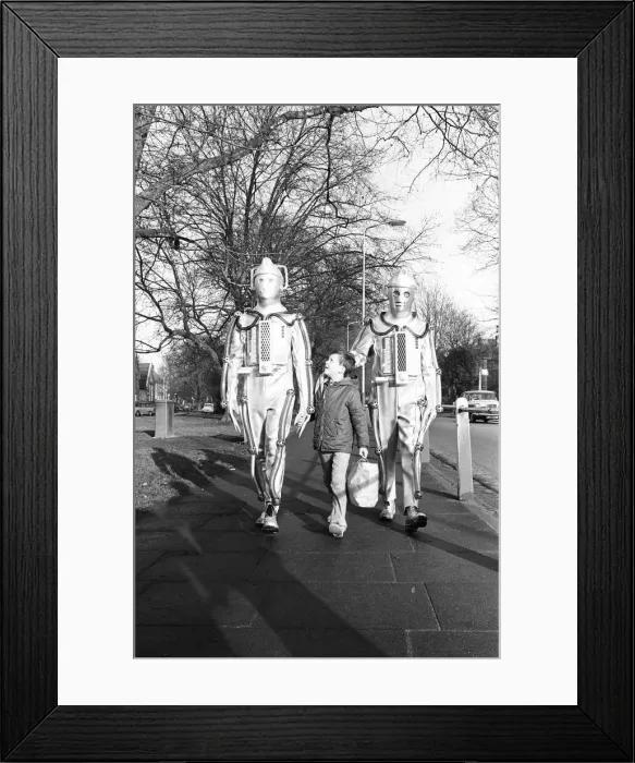 Framed Print : Cybermen take a break from filming at the BBC Ealing studios for Dr Who story call