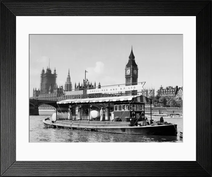 Framed Print : A floating Shell Mex and BP filling station on the River Thames with Big Ben