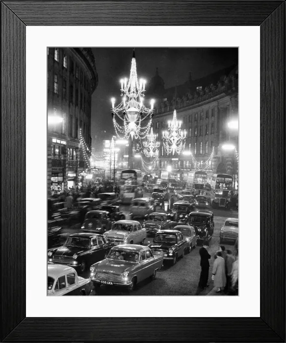 Framed Print : Regent Street packed with traffic as new Christmas lights in the form of chandeliers Framed Print : Regent Street packed with traffic as new Christmas lights in the form of chandeliers
