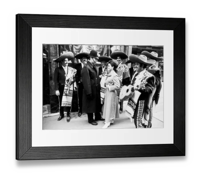 Framed Print : Mexican singer Maria de Lourdes tries her charms on a London policeman to no avail