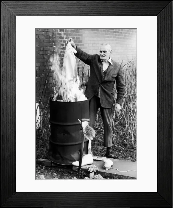 Framed Print : 71 year old Tom Lawford burns his whites at the end of his 60 year amateur cricket career Framed Print : 71 year old Tom Lawford burns his whites at the end of his 60 year amateur cricket career