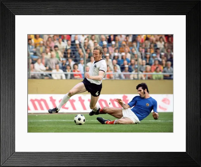 Framed Print : World Cup 1974 W. Germany v Yugoslavia Schwarzenbeck rides a