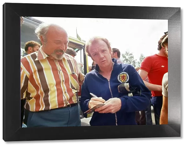 World Cup 1974 Billy Bremner signing autographs after a Scotland training