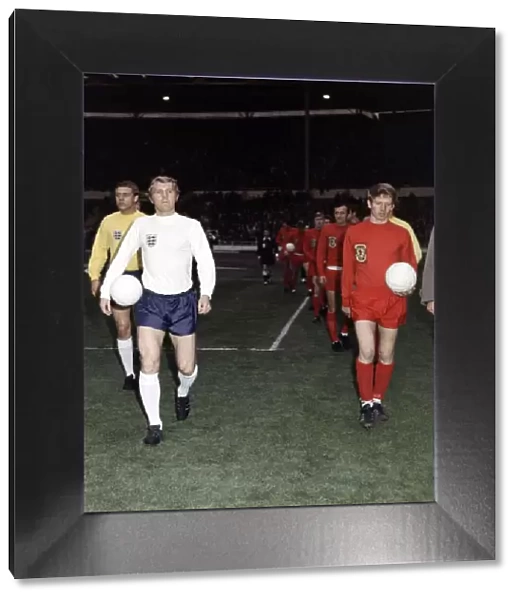 Football England v Wales 1969 Bobby Moore walks on to the pitch with ball under