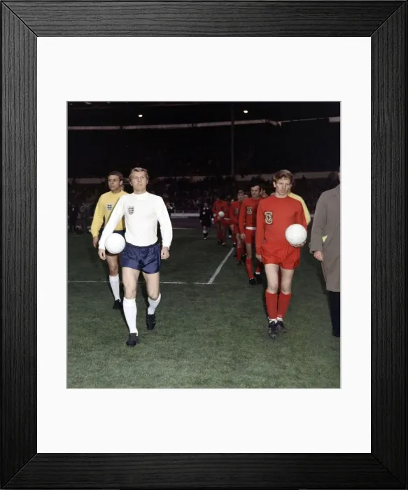 Framed Print : Football England v Wales 1969 Bobby Moore walks on to the pitch with ball under
